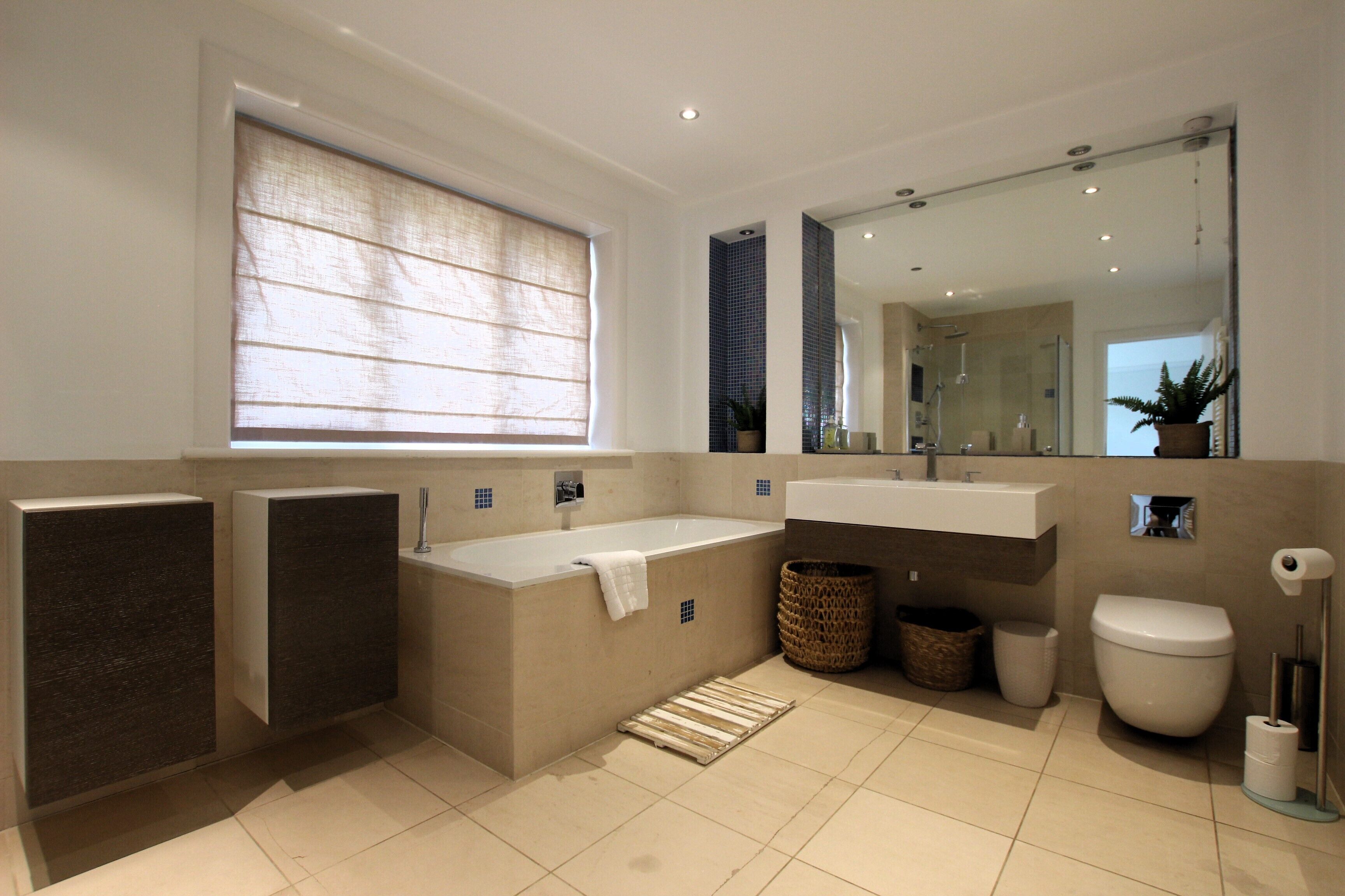 Bathtub, towels, toilet paper
