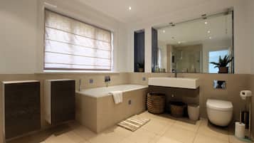 Bathtub, towels, toilet paper