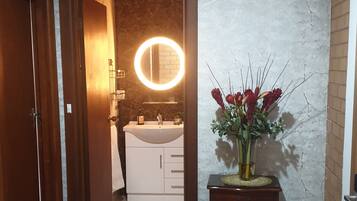 Shower, hair dryer, towels, soap