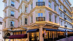 A multi-story building with a classic architectural style, featuring balconies and large windows. - Meroddi Barnathan Hotel (Istanbul)