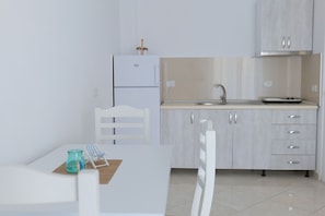 Quarto quádruplo, sacada | Cozinha privada