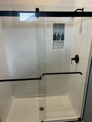 Combined shower/tub, hair dryer, towels, soap
