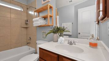 Hair dryer, towels, shampoo, toilet paper