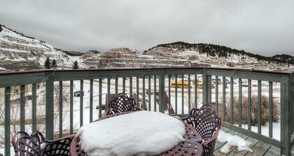 Historical home right in town with tons of character, fireplace & great deck
