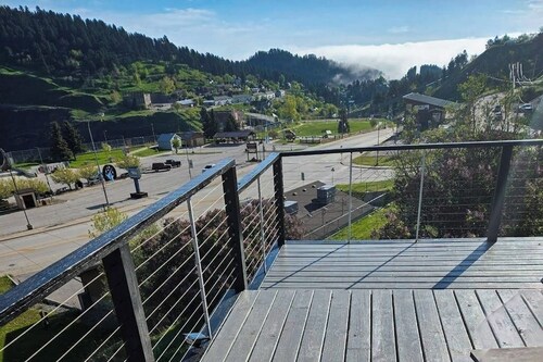 Historical home right in town with tons of character, fireplace & great deck