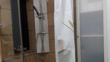 Shower, towels, toilet paper