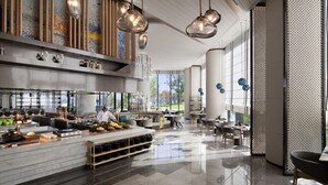 A spacious, modern hotel lobby with a central island, seating areas, and large windows offering views of the outdoors. - Qinhuangdao Marriott Resort (Qinhuangdao)