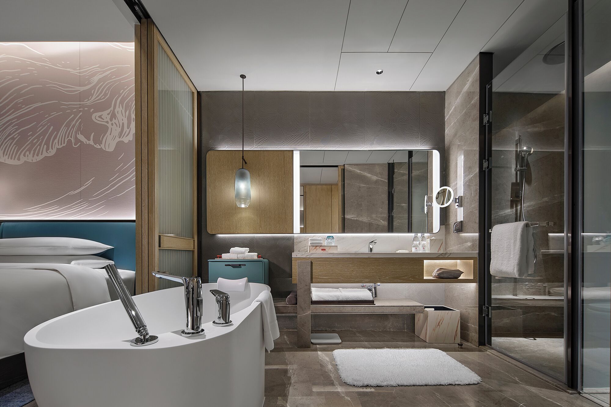 A modern bathroom with a freestanding bathtub, a vanity with a mirror, and a glass-enclosed shower area.
