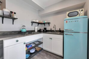 Fridge, microwave, stovetop, coffee/tea maker