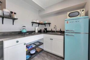 Fridge, microwave, stovetop, coffee/tea maker