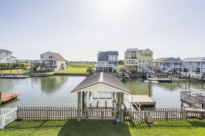 Enjoy waterfront living with balconies and decks, a gazebo for relaxation, and access to boating activities.