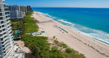 Modern condo near towering palms with beach decor, grill, & yard - walk to beach