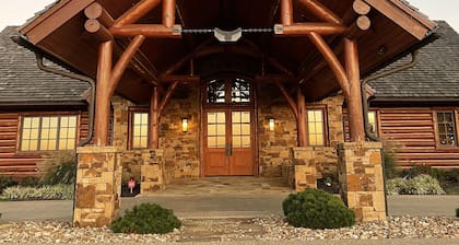 A one-of-a-kind Log Lodge on over 200 acres of panoramic views & serene settings