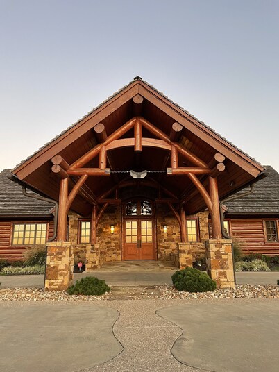 A one-of-a-kind Log Lodge on over 200 acres of panoramic views & serene settings
