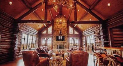 A one-of-a-kind Log Lodge on over 200 acres of panoramic views & serene settings