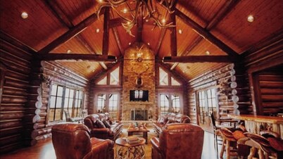 A one-of-a-kind Log Lodge on over 200 acres of panoramic views & serene settings
