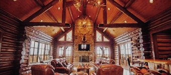 A one-of-a-kind Log Lodge on over 200 acres of panoramic views & serene settings