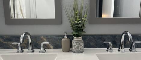 Combined shower/tub, hair dryer, towels, soap