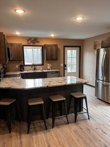 Cozy two level home - 2 minutes from beach on private wooded lot.