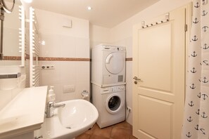 Shower, hair dryer, towels