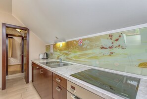 Enjoy cooking in this well-equipped kitchen with an oven, microwave, and dishwasher.