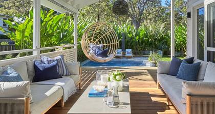 This home matches quaint beachside charm with luxurious comfort.