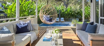 This home matches quaint beachside charm with luxurious comfort.