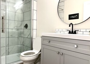 Combined shower/tub, hair dryer, towels, soap