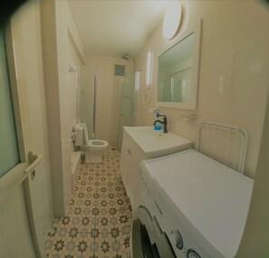 Shower, towels, soap, toilet paper