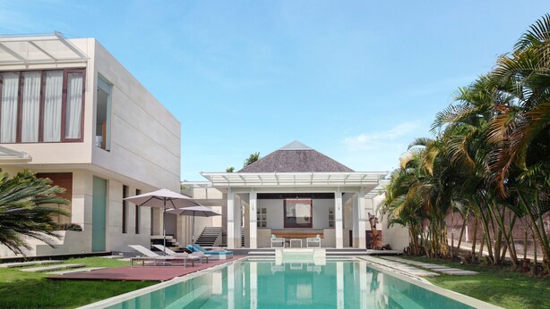 Un hôtel moderne doté d’une piscine, de chaises longues et de palmiers.