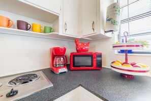 Fridge, microwave, stovetop, coffee/tea maker
