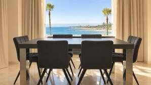 A dining area with a view of the beach and ocean. - B51 Executive Flats Marbella Puerto Banus (Marbella)