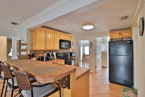 House, 3 Bedrooms | Private kitchen - 813 E 6th Ave 3 Bedroom Home by RedAwning (New Smyrna Beach)