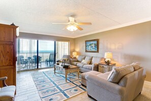 Living area - Recently Renovated Beach Condo with Large Patio Deck and Ocean View by RedAwning (Fernandina Beach)