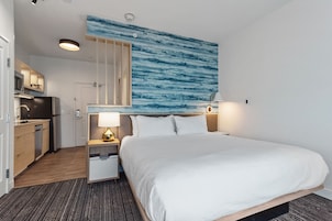 Tabla de planchar con plancha, wifi gratis y ropa de cama 