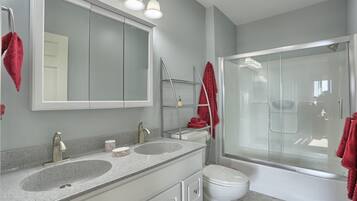 Combined shower/tub, hair dryer, towels, soap