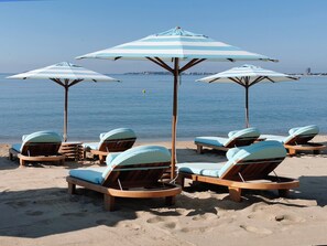 On the beach, beach cabanas, sun-loungers, beach umbrellas
