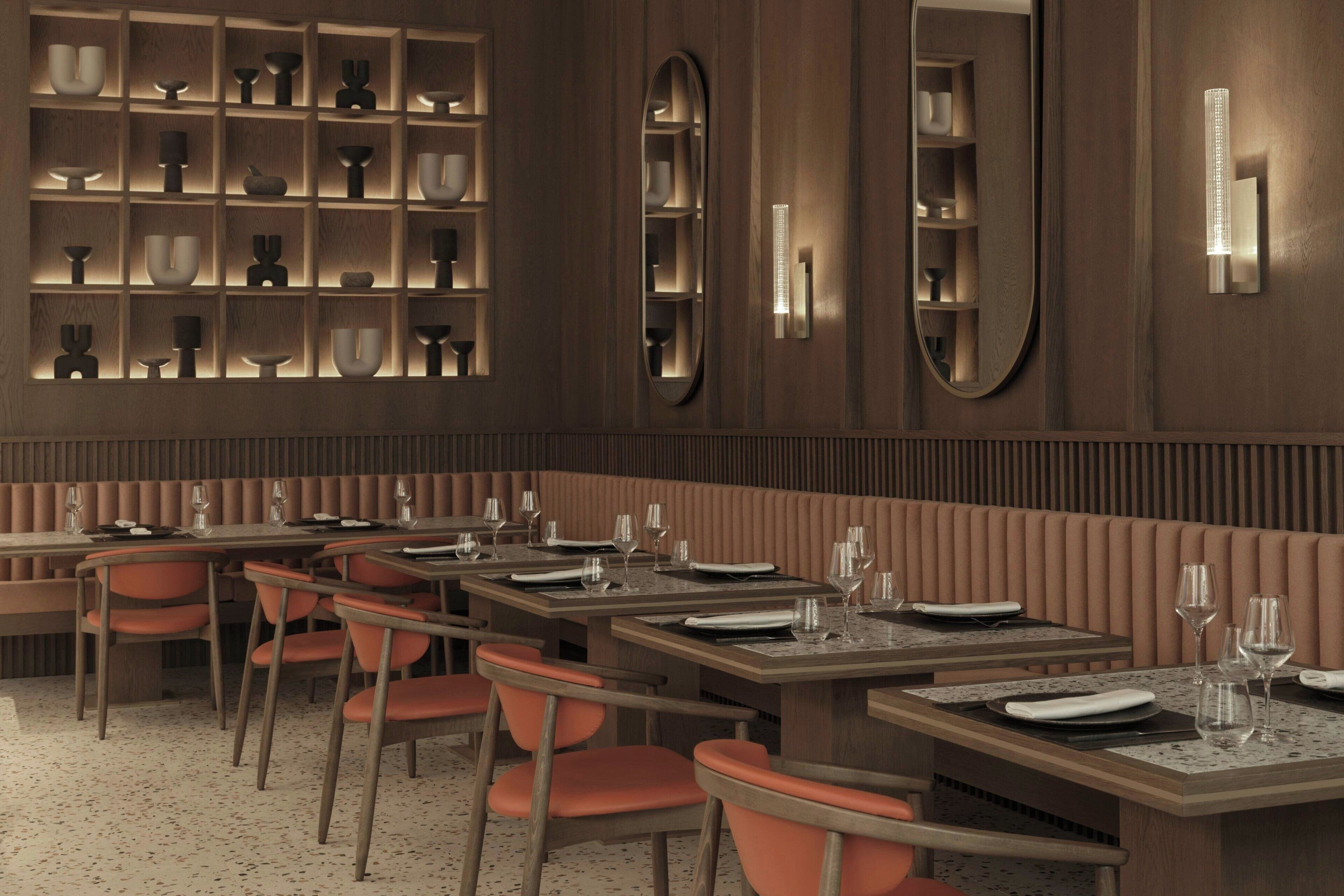 A restaurant with wooden paneling, a long counter with orange chairs, and shelves with various dishes and glassware.