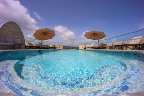 Outdoor pool, open 8:00 AM to 10:00 PM, free cabanas