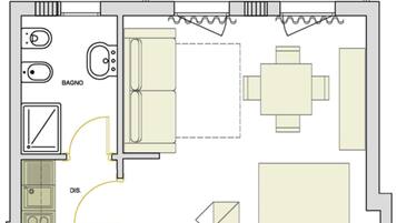 A kitchen with a stove, sink, and a dining area with a table and chairs.