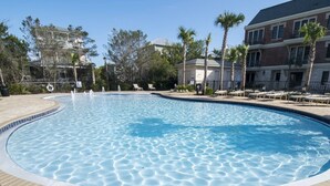 A swimming pool with a tiled edge, surrounded by lounge chairs and palm trees. - Large, True 1 BR, Between Alys & Rosemary (Seacrest)