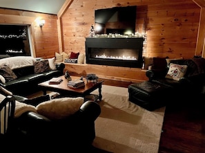 Smart TV, fireplace, books, stereo