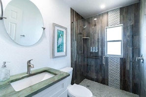 Shower, hair dryer, towels, shampoo
