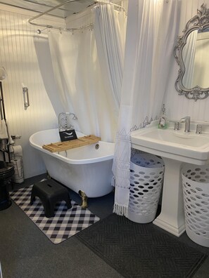 Combined shower/tub, hair dryer, towels, soap