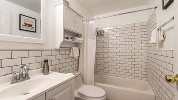 Combined shower/bathtub, hair dryer, towels, soap