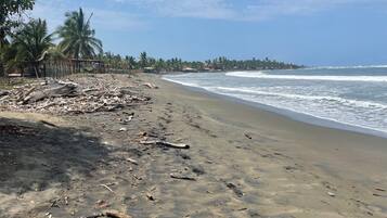 On the beach, sun-loungers, beach towels