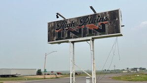 A billboard with the text "High Plains INTN" on a rural roadside. - High Plains Inn (Newell)