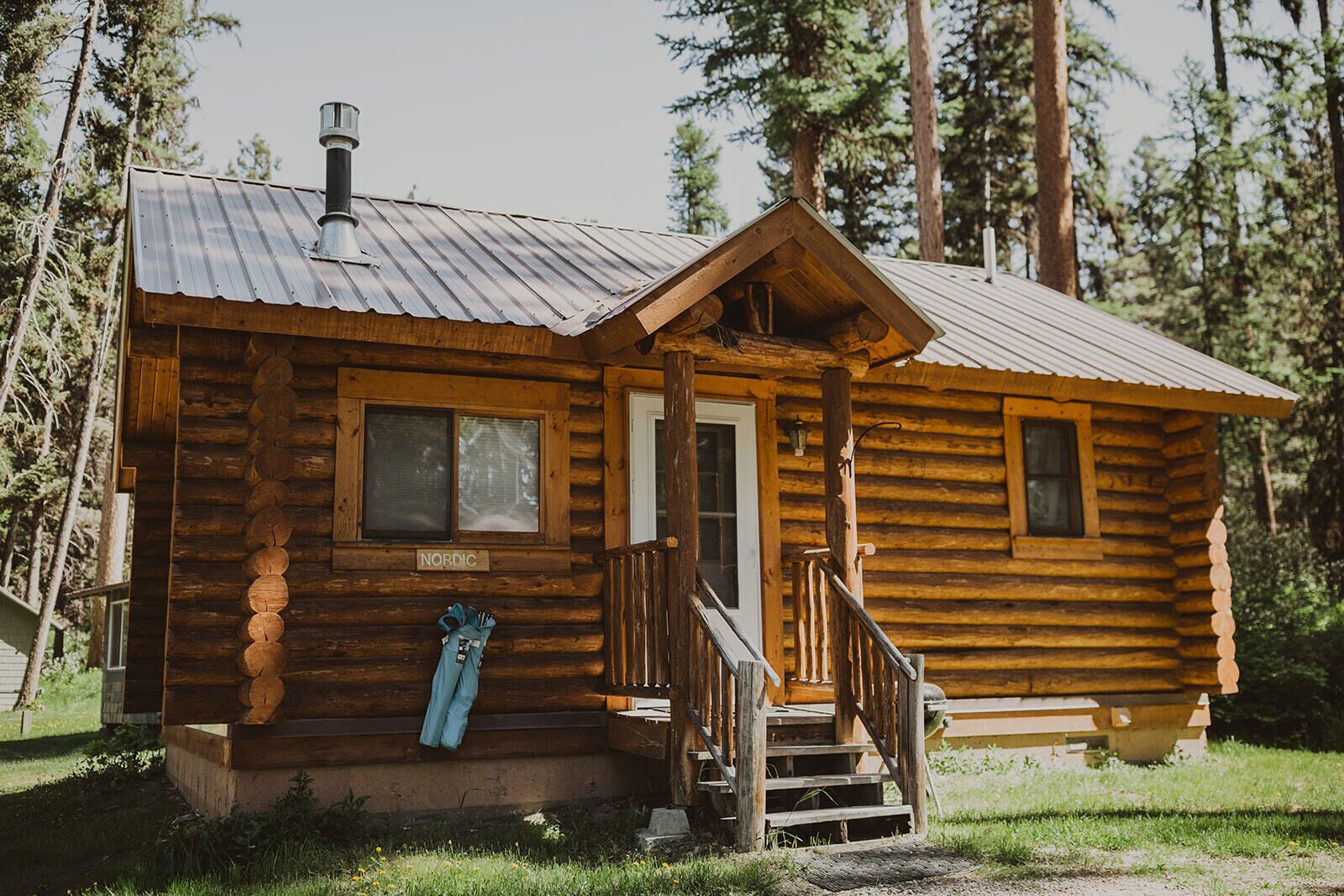 Nordic Cabin at Tamaracks Resort, a cozy log cabin with views of Seeley Lake. 