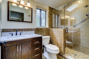 A bathroom with a vanity, a toilet, a shower enclosure, and a large mirror. - 20 Ruddy Turnstone at The Sea Pines Resort (Hilton Head Island)