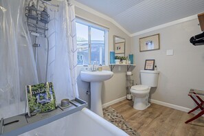 A relaxing spa-like bathroom to indulge in long bubble baths.